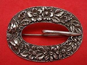 Silver relief by various manufacturers buckle brooch