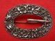 Silver relief by various manufacturers buckle brooch